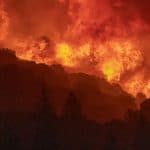 The wildfires in California have burned 2.2 million acres of land; 14,000 workers are working continuously to extinguish the fire