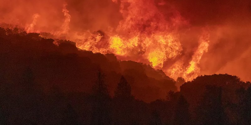 The wildfires in California have burned 2.2 million acres of land; 14,000 workers are working continuously to extinguish the fire