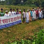 a human chain of villagers from six villages to protect the kajli river in munshiganj, bangladesh
