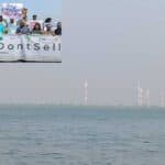 youth human chain demanding increased investment in renewable energy to combat climate change